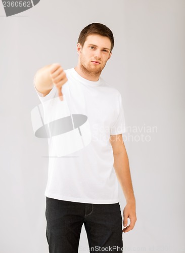 Image of man showing thumbs down