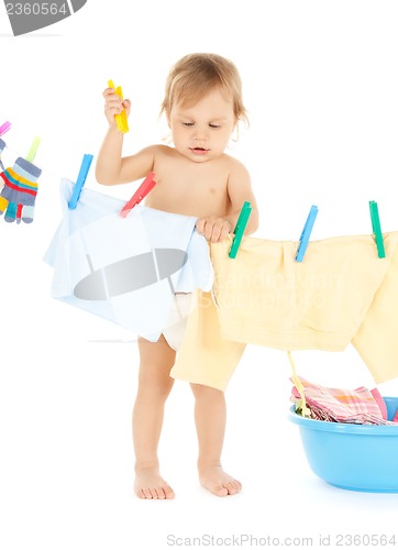 Image of baby doing laundry