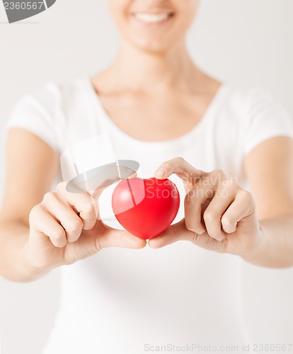 Image of woman hands with heart