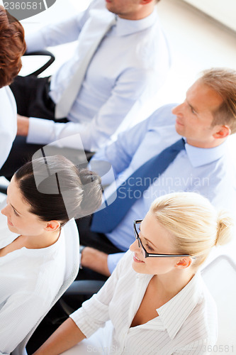 Image of businessmen and businesswomen on conference