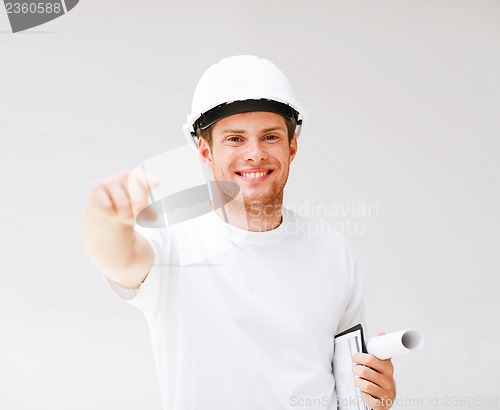 Image of male architect in helmet pointing at you