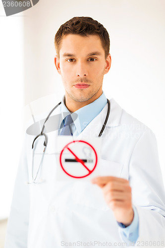 Image of male doctor holding no smoking sign