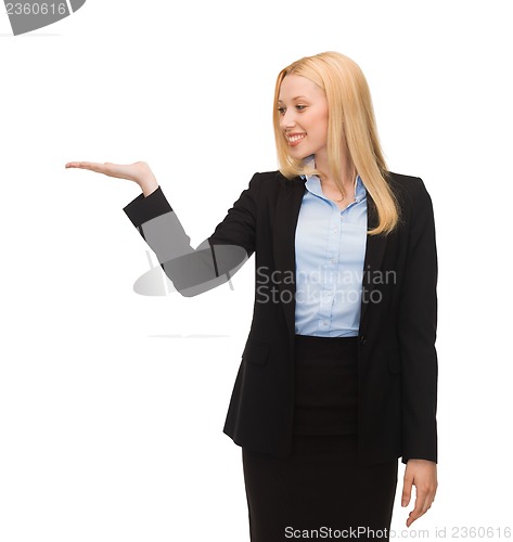 Image of man showing something imaginary on her hand
