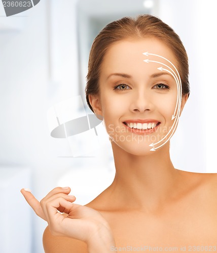 Image of beautiful woman with moisturizing creme drop