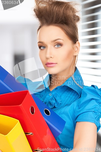 Image of happy woman with folders