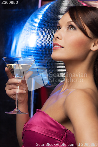 Image of woman with cocktail and disco ball
