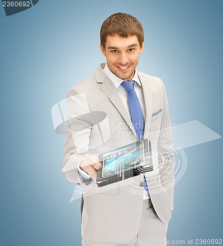 Image of businessman with tablet pc and virtual screen