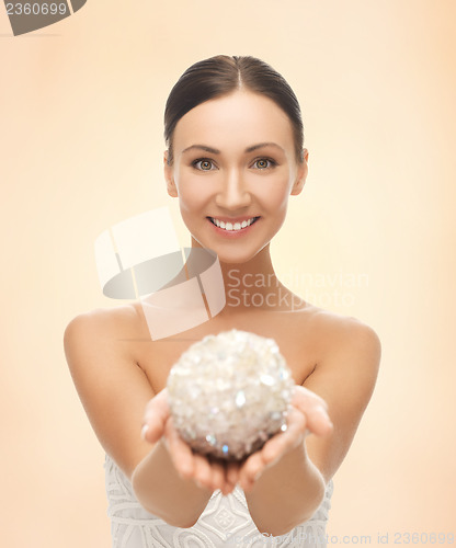 Image of woman with sparkling ball