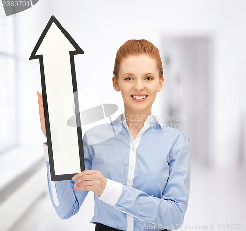Image of woman with direction arrow sign