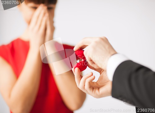 Image of couple with wedding ring and gift box