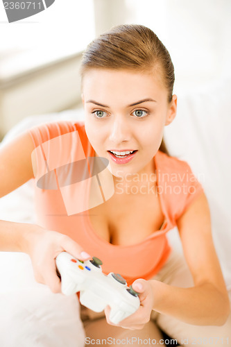 Image of woman with joystick playing video games