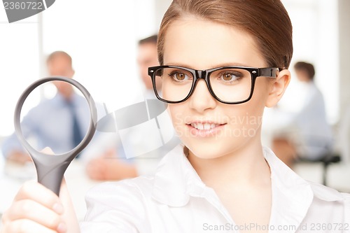 Image of woman with magnifying glass