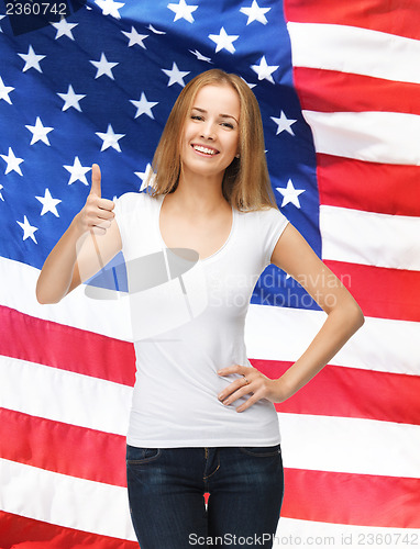 Image of teenage girl in blank white t-shirt with thumbs up