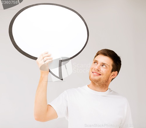 Image of smiling young man with blank text bubble