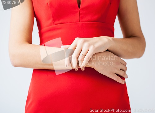 Image of woman showing wedding ring on her hand