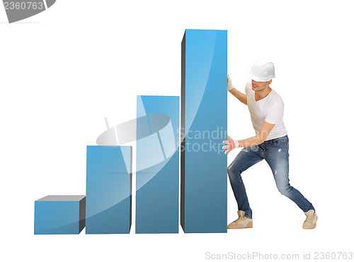 Image of handsome builder moving big chart