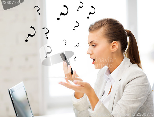 Image of woman shouting into smartphone