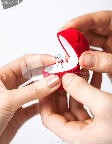 Image of couple with wedding ring and gift box