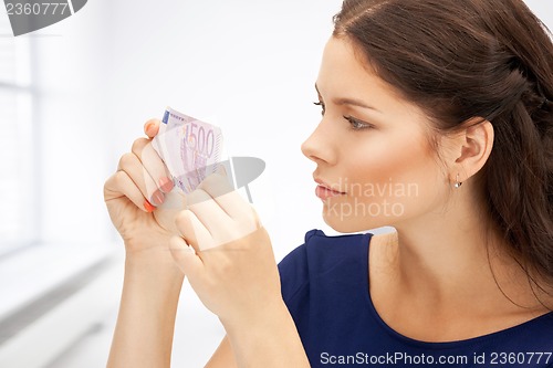 Image of lovely woman with euro cash money