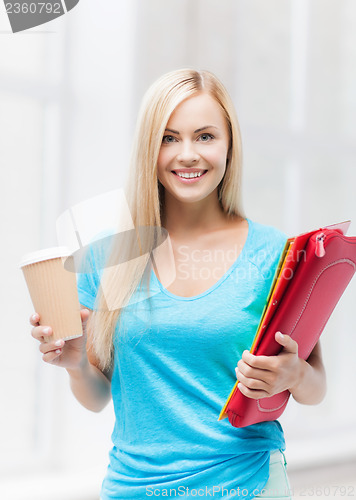 Image of smiling student with folders