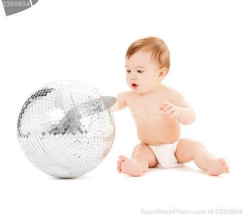 Image of child playing with disco ball