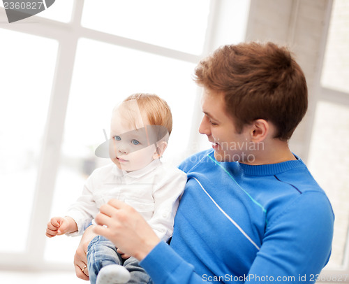 Image of happy father with adorable baby