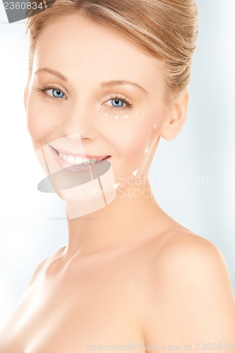 Image of face and hands of beautiful woman