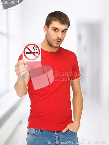 Image of man in red shirt with no smoking sign