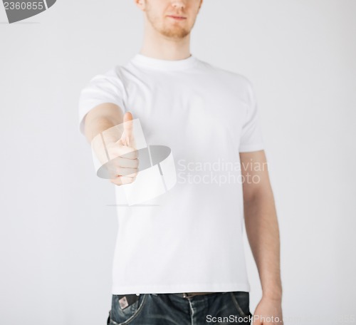 Image of man showing thumbs up