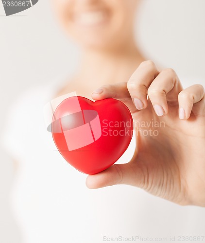 Image of woman hands with heart