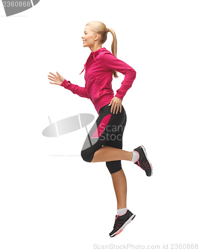 Image of sporty woman running or jumping