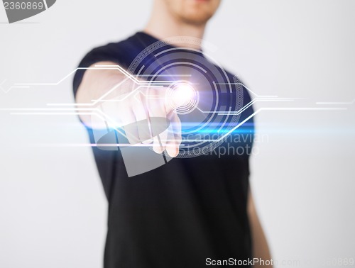 Image of male hand touching virtual screen