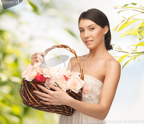 Image of woman with basket full of flowers