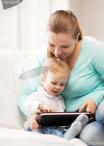 Image of mother and adorable baby with tablet pc