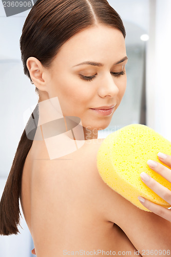 Image of beautiful woman with sponge