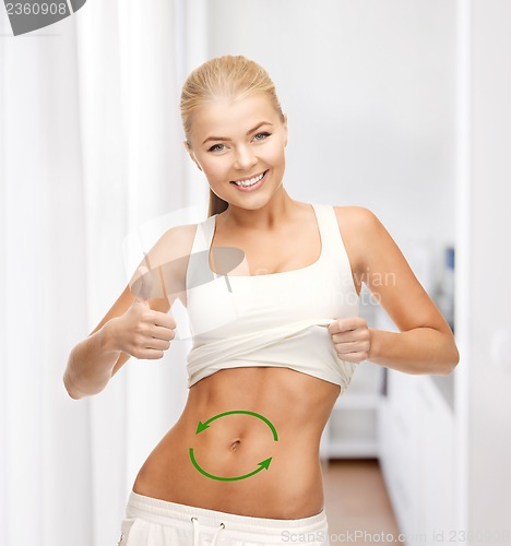Image of woman with arrows on her stomach