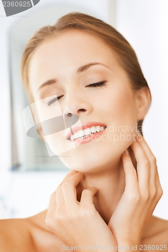 Image of face and hands of beautiful woman
