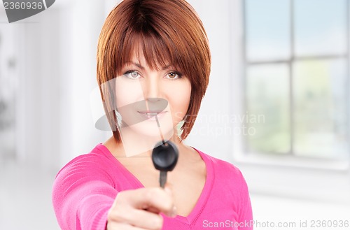 Image of happy woman with car key