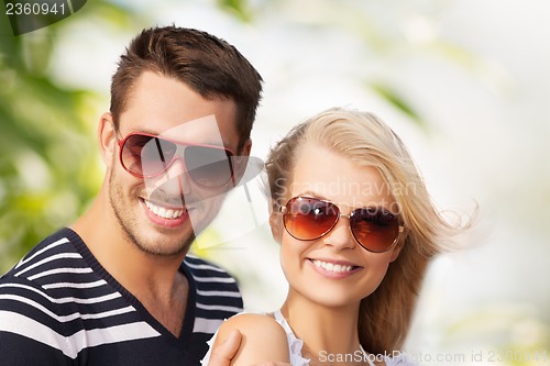 Image of happy young couple in the woods