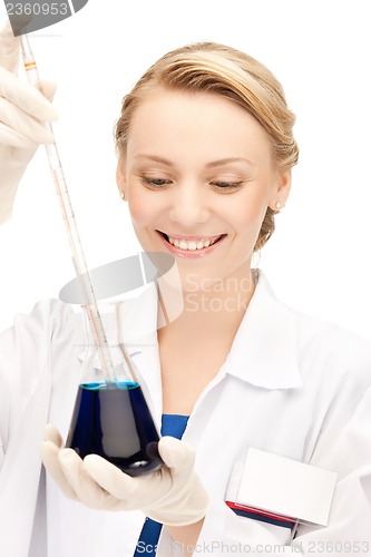 Image of female chemist holding bulb with chemicals