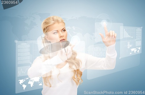 Image of businesswoman working with virtual screens