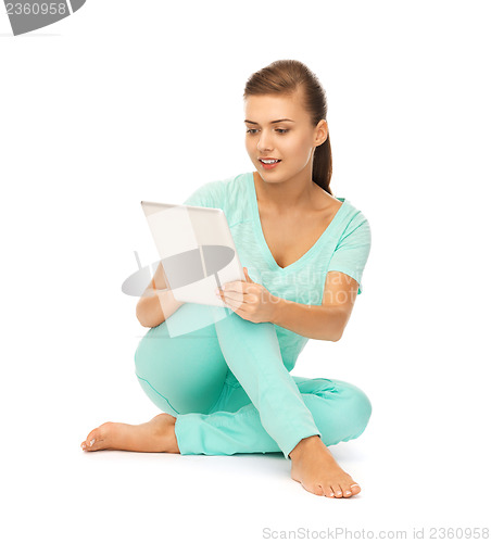 Image of girl sitting on the floor with tablet pc