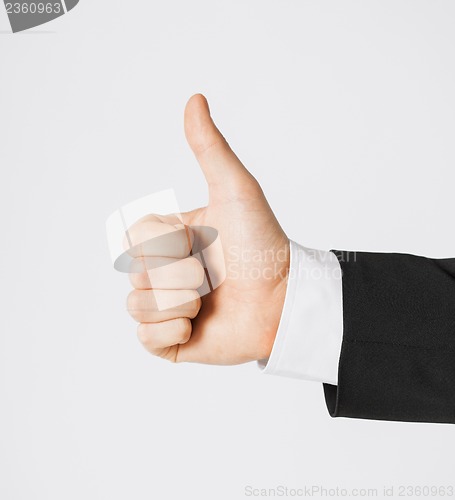 Image of man showing thumbs up