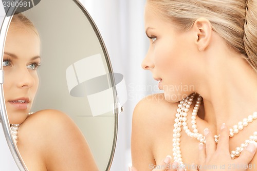 Image of woman with pearl necklace