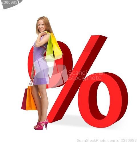 Image of woman with shopping bags and percent signs