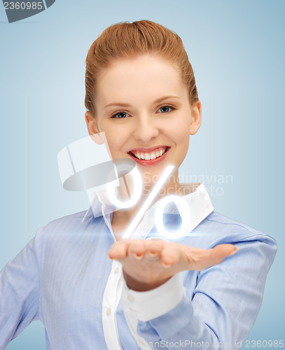 Image of woman showing sign of percent in her hand