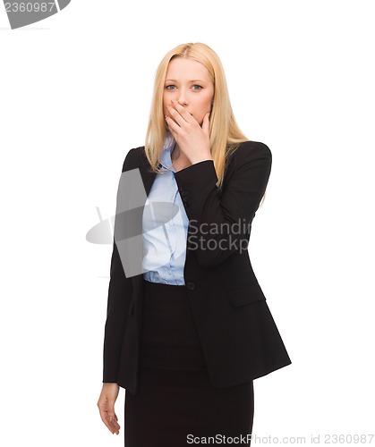 Image of businesswoman closing her mouth with hand