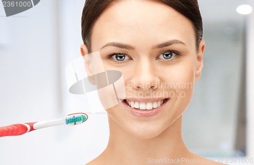 Image of beautiful woman with toothbrush