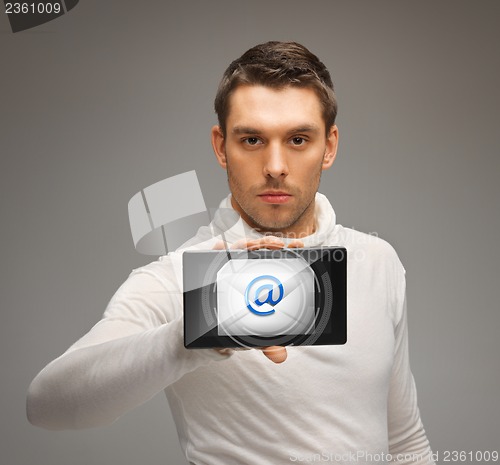 Image of man holding tablet pc with email icon