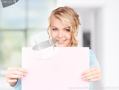 Image of happy woman with blank board